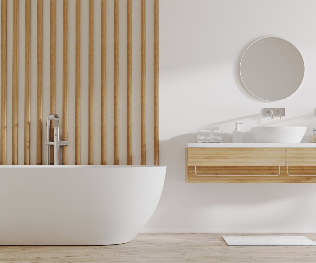 A bathroom featuring a large stand-alone bathtub with alternating wood panels decorating the wall behind it.