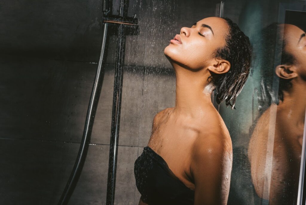A woman taking her time bathing in the shower