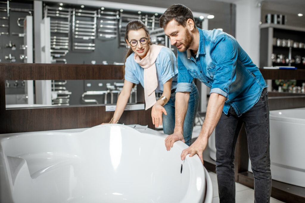 A couple is carefully choosing a bathtub for their home.